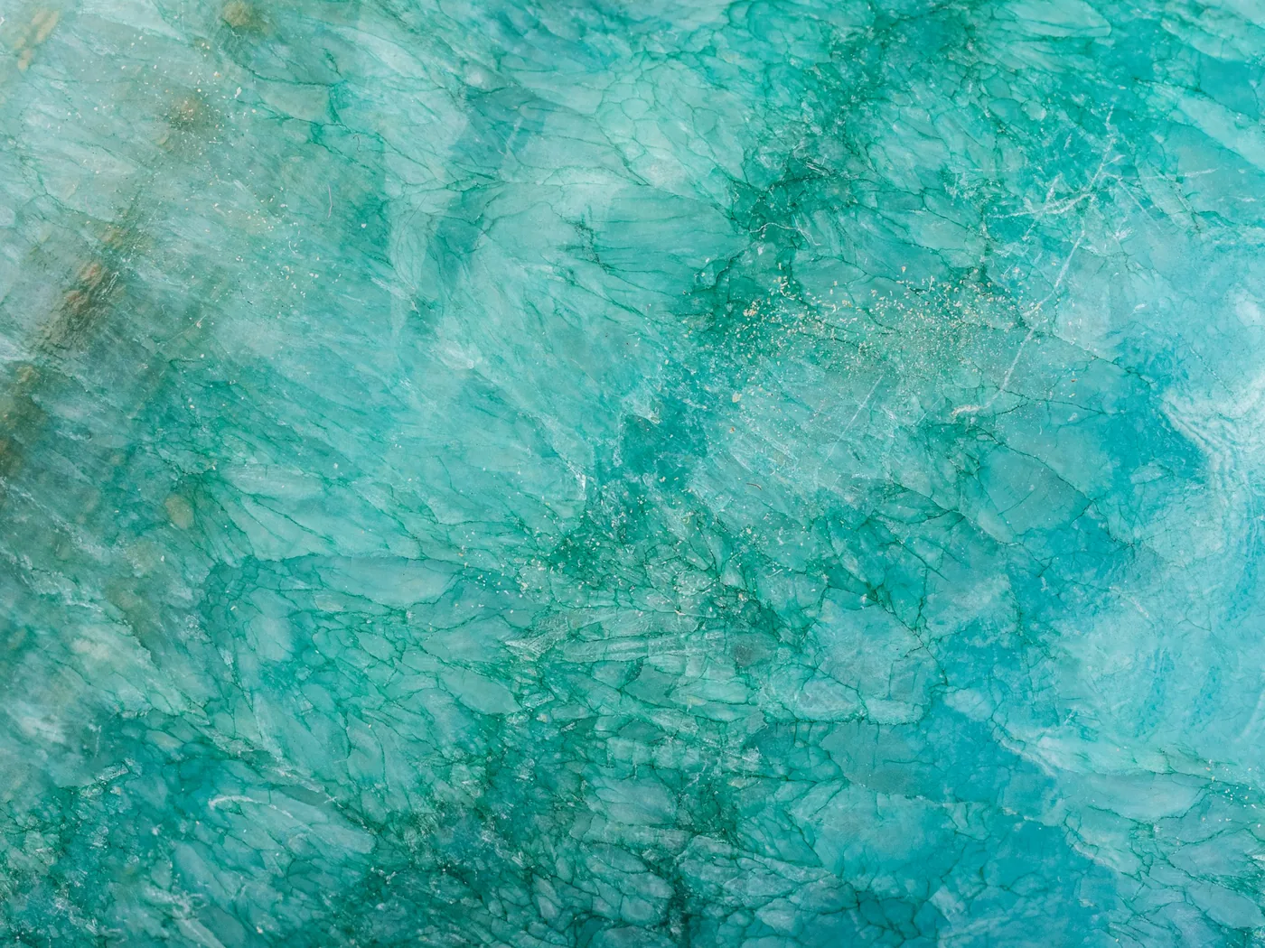 A narrow turquoise gorge with polished rock walls in the Bernese Oberland